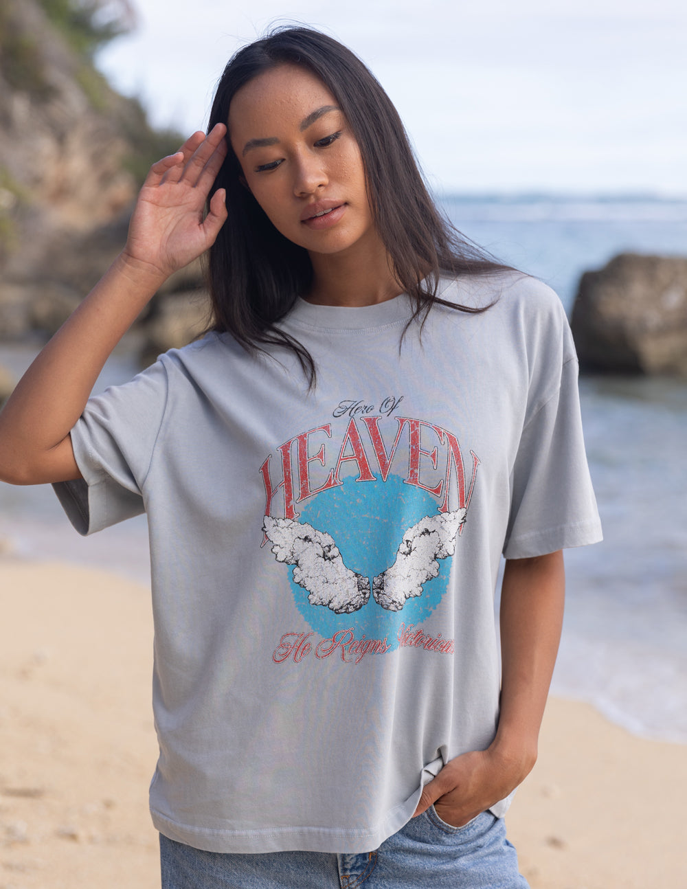 Elevated Faith Hero of Heaven Unisex Tee — Elevated Faith branding close-up
