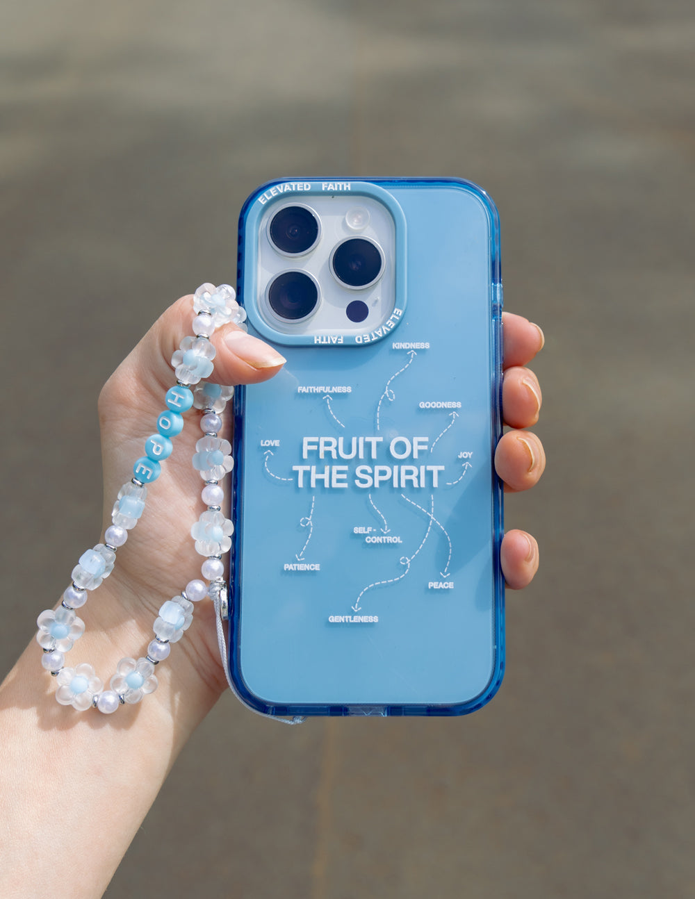 Elevated Faith Fruit of the Spirit Phone Case — lifestyle worn / used context