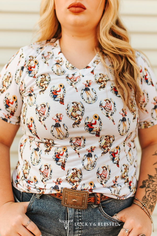 Whiskey Black & Co Lucky & Blessed Cowgirl Pinup Printed Short-Sleeve Top — Cowgirl Pinup pattern detail