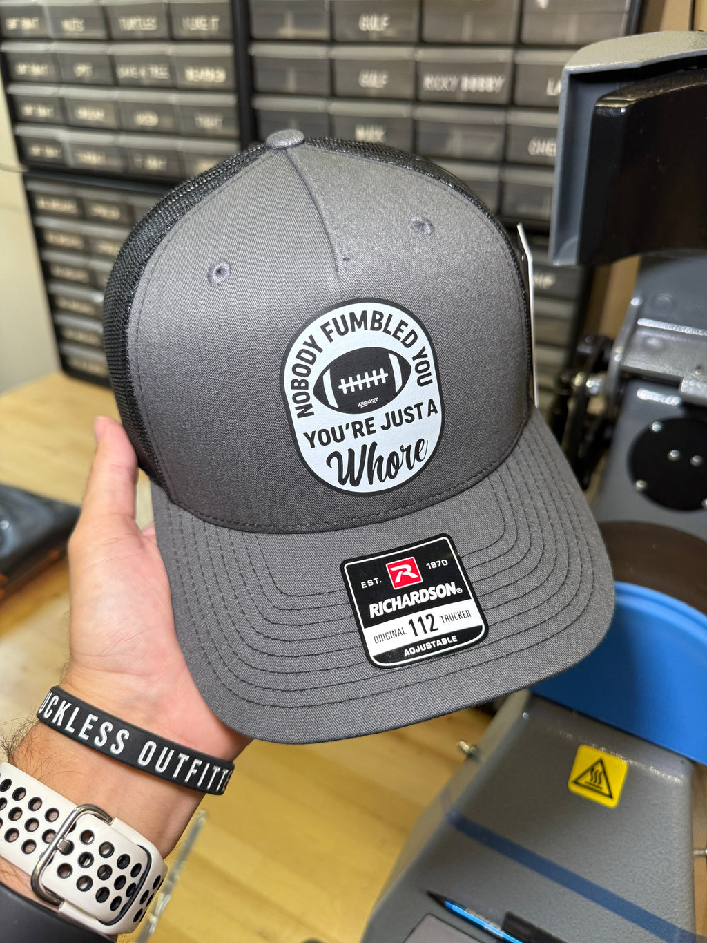 Luckless Outfitters Nobody Fumbled You Trucker Hat — detail close-up