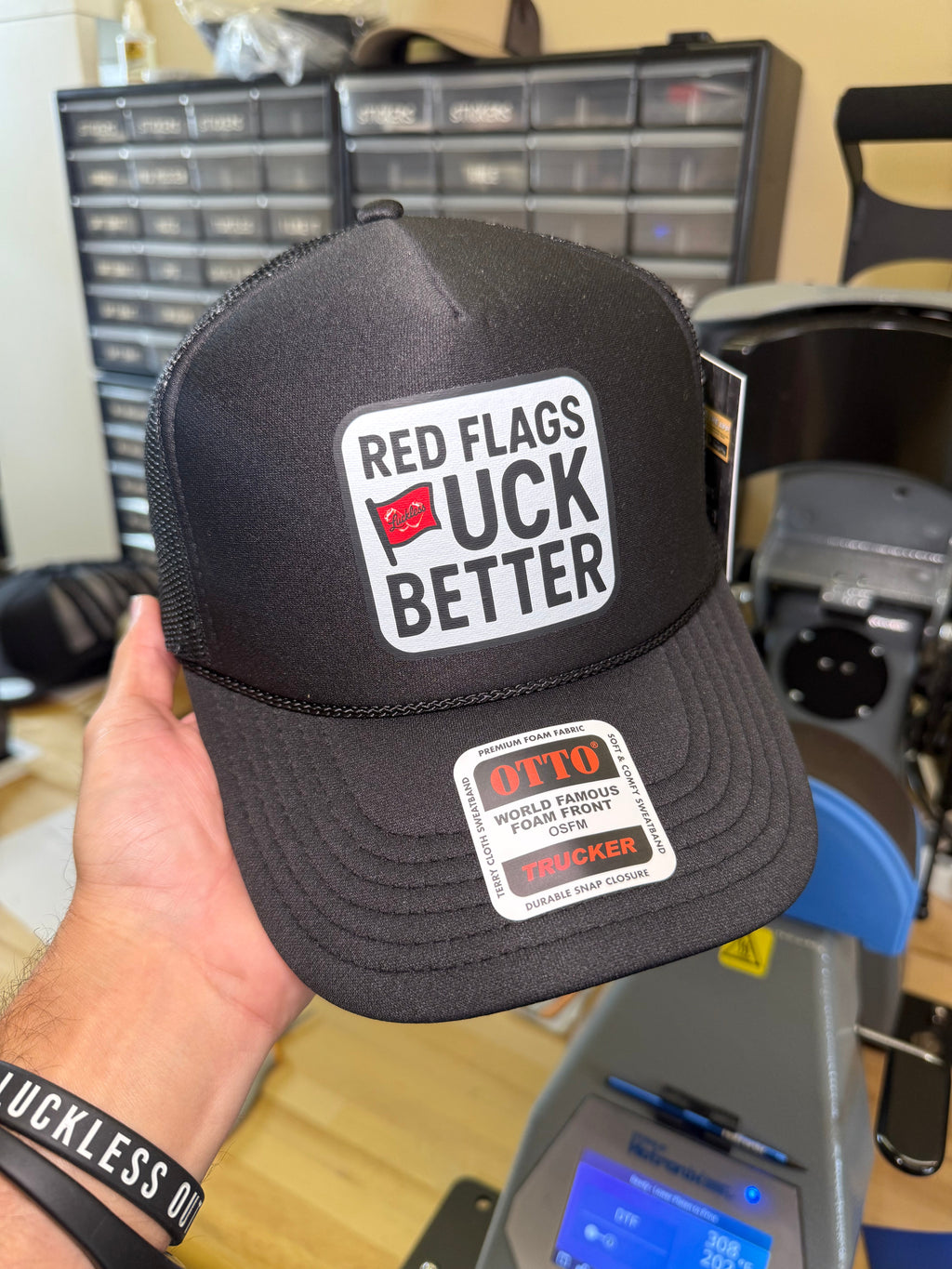 Luckless Outfitters Red Flags Fuck Better Trucker Hat — side view