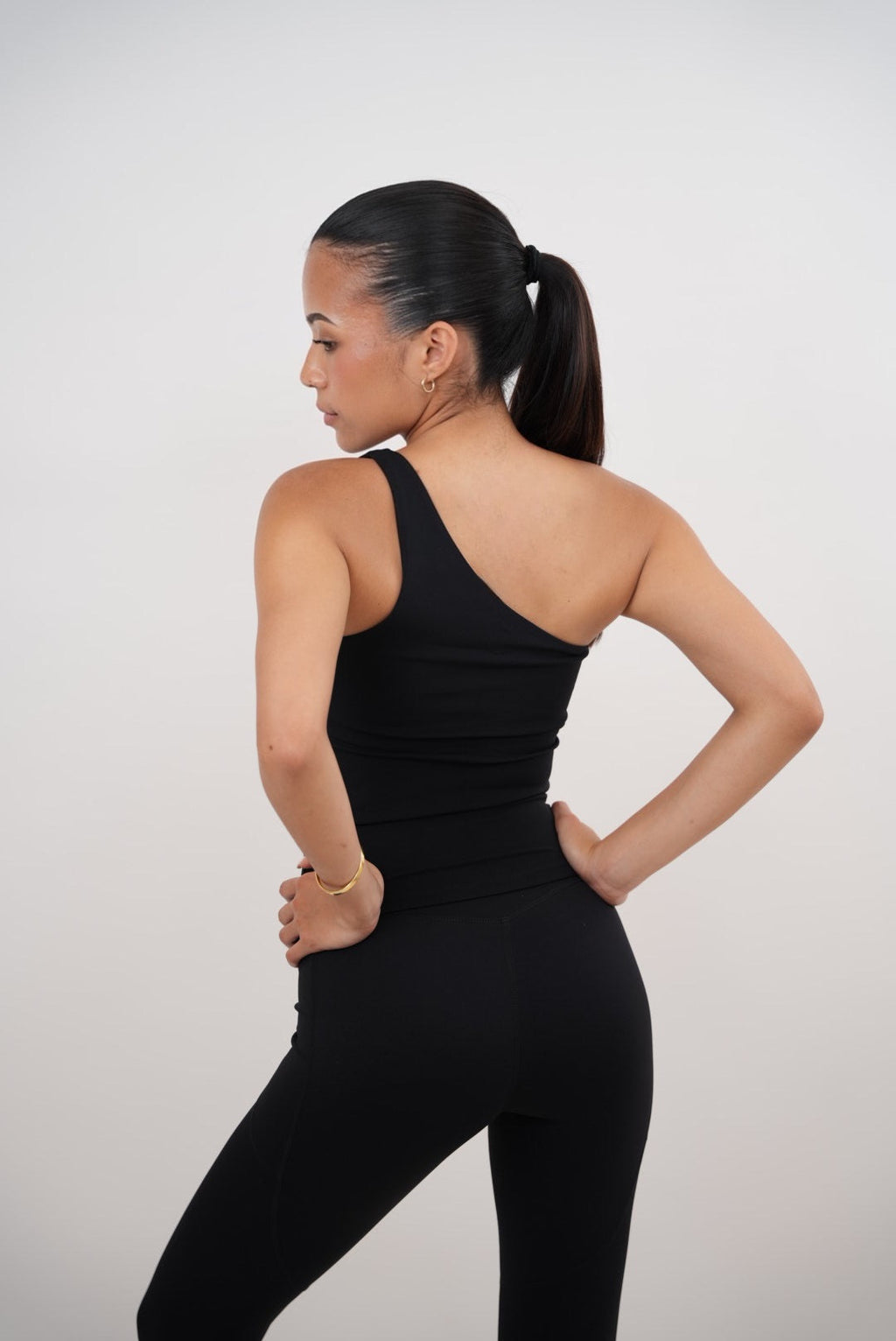 KIMITH BRAND I Am Wealthy Black One Shoulder Top — detail close-up