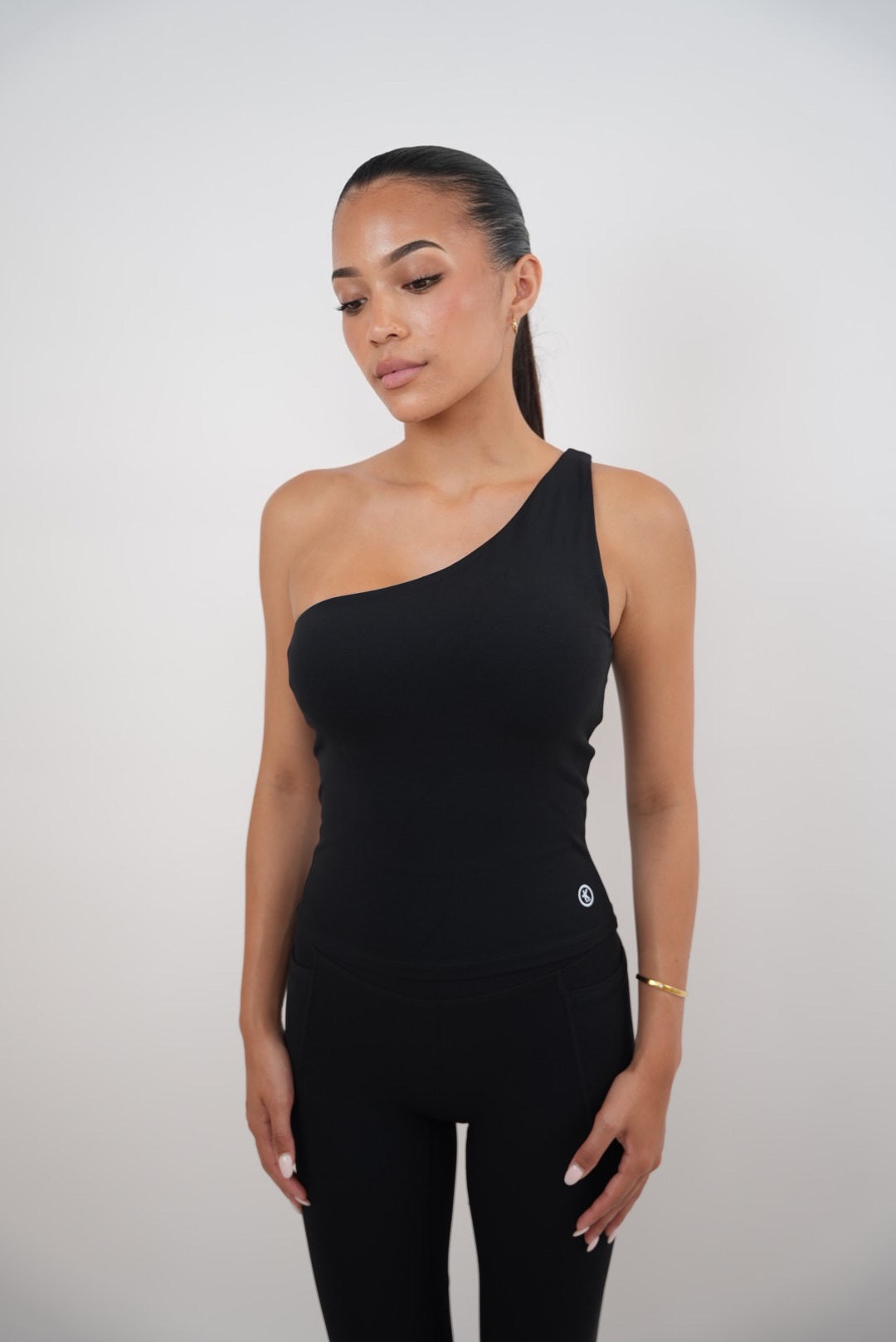 KIMITH BRAND I Am Wealthy Black One Shoulder Top — lifestyle context