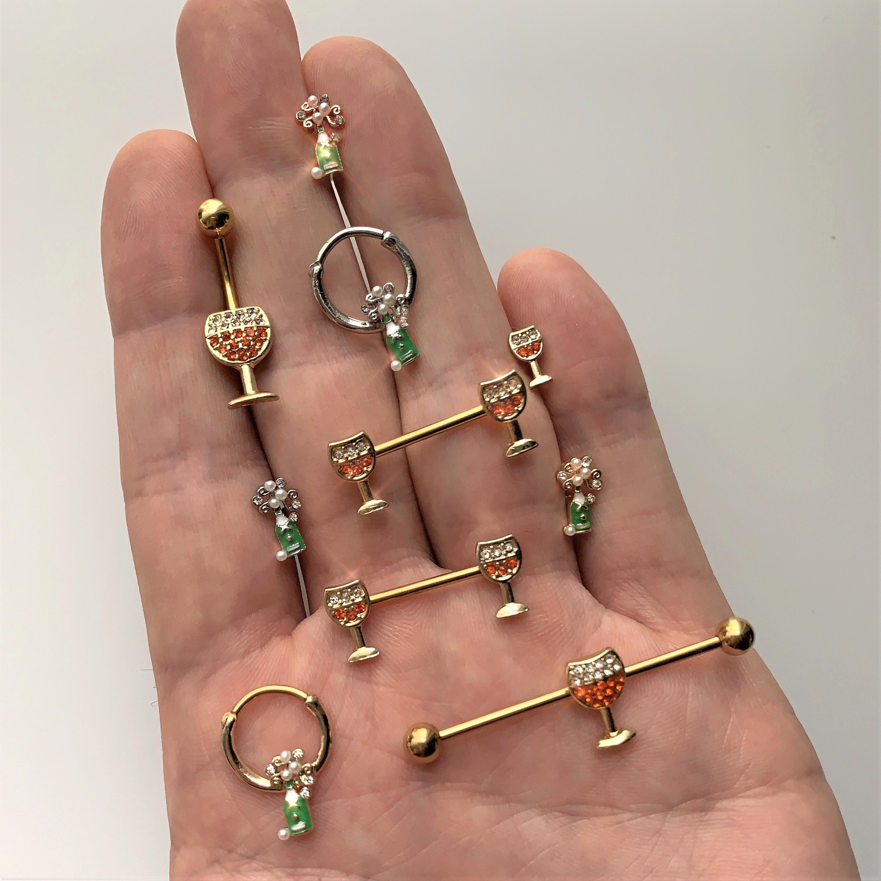 BodyCandy 14G 9/16 Orange Gem Gold Tone Holiday Wine Nipple Ring Set — detail close-up