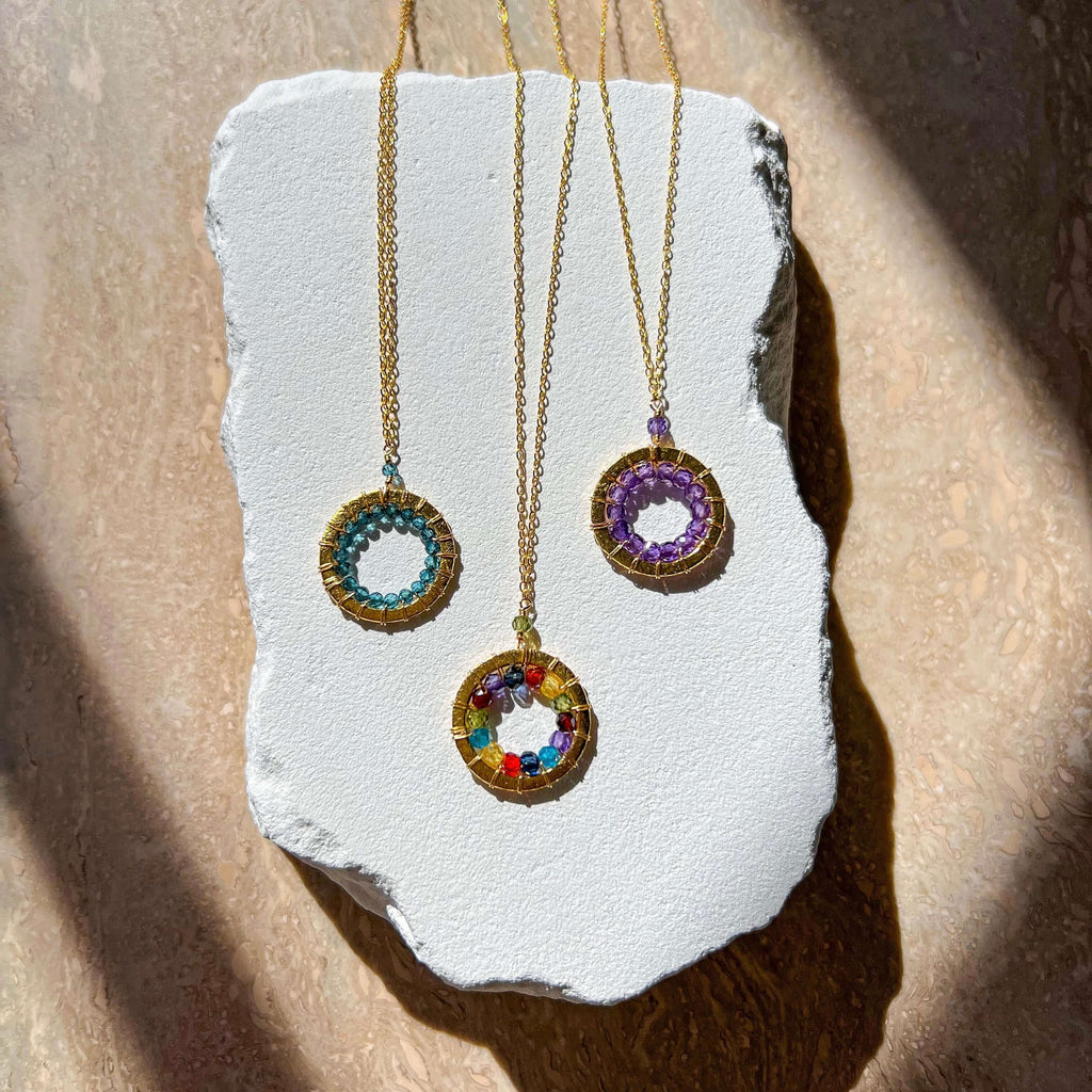 PARKEN JEWELRY London Blue Quartz, Rainbow Gemstone and Amethyst Halo Mini Gold Pendants — lifestyle worn / used context
