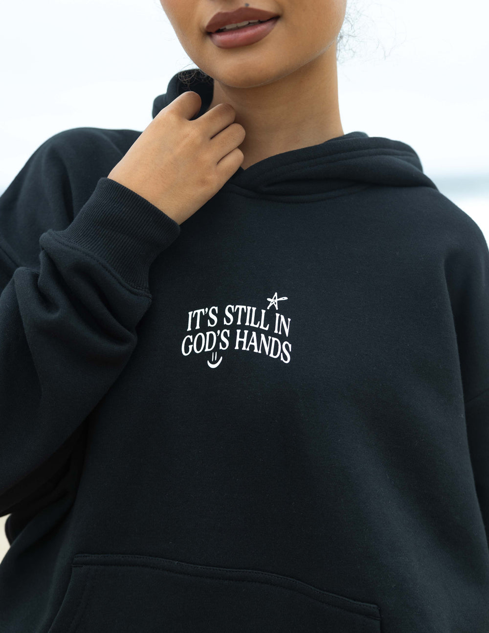 Elevated Faith In God's Hands Unisex Hoodie — lifestyle context