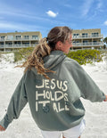 Elevated Faith Jesus Holds It All Unisex Hoodie — main product shot