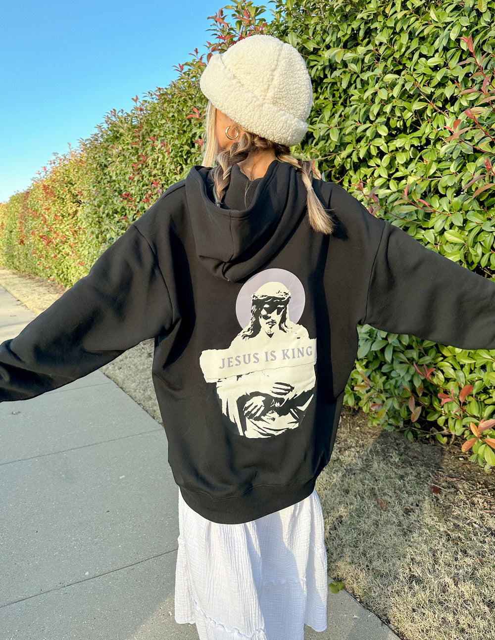 Elevated Faith Jesus Is King Black Unisex Hoodie — Elevated Faith branding close-up