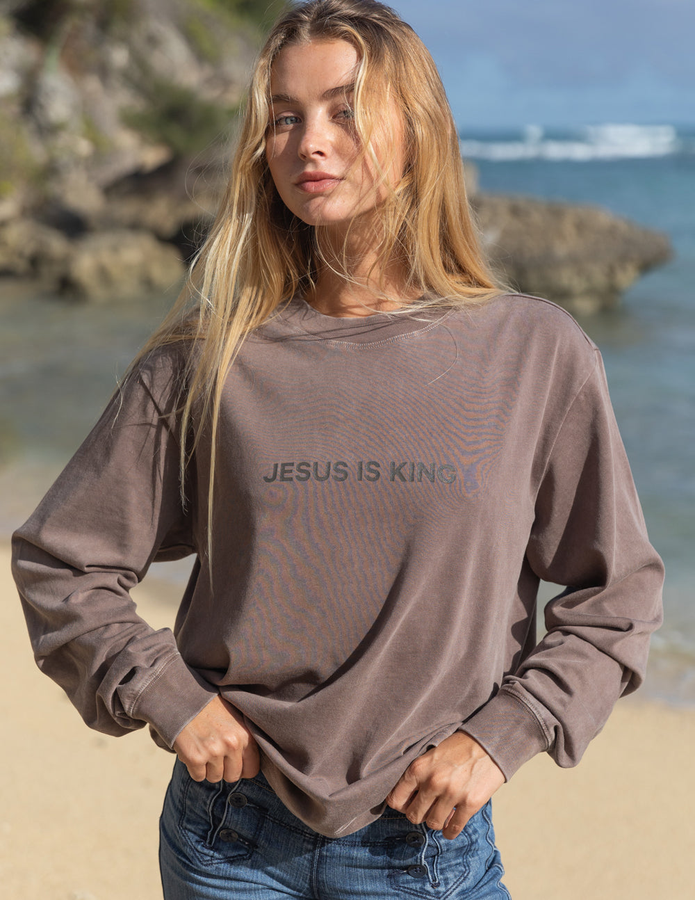 Elevated Faith Jesus Is King Brown LS Unisex Tee — Elevated Faith branding close-up