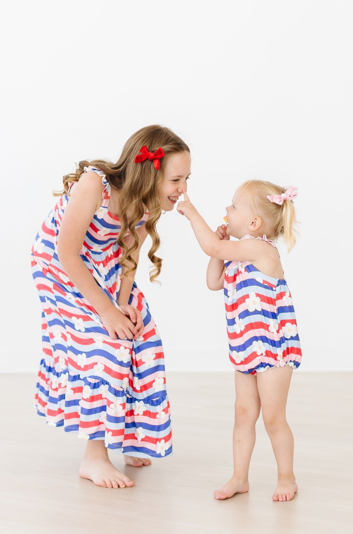 Mila & Rose ® July Vibes Ruffle Cross Back Romper — detail close-up