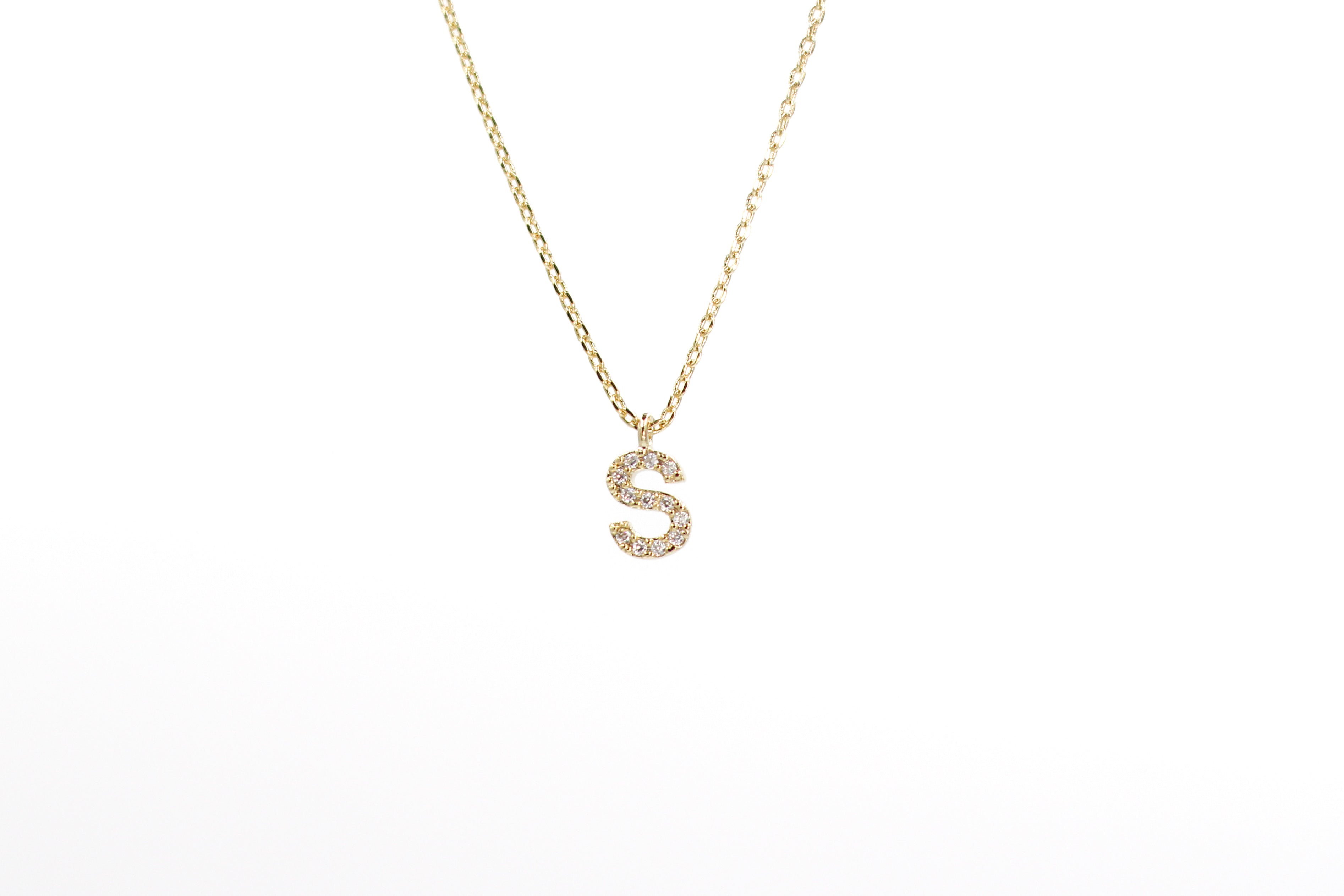 KADOU BOUTIQUE Cubic Zirconia Letter Necklace — detail close-up