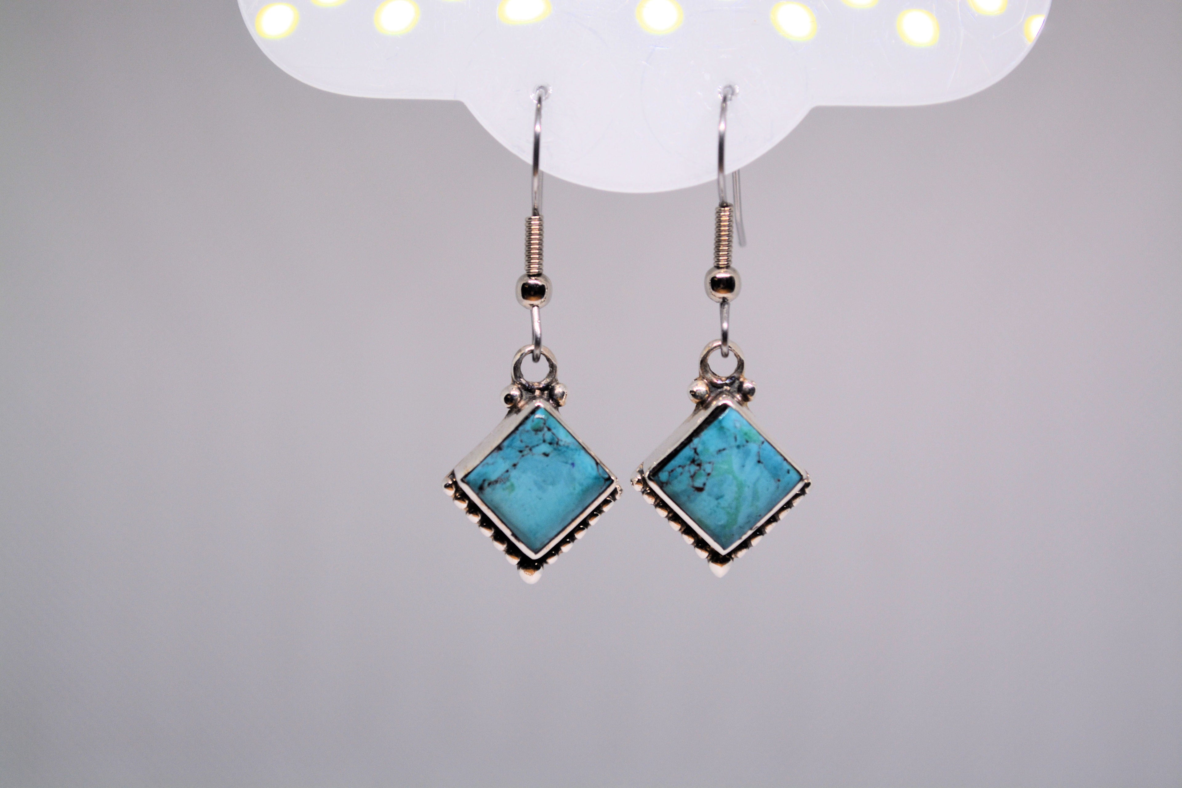 Just Neat Stuff Turquoise square drops — lifestyle context