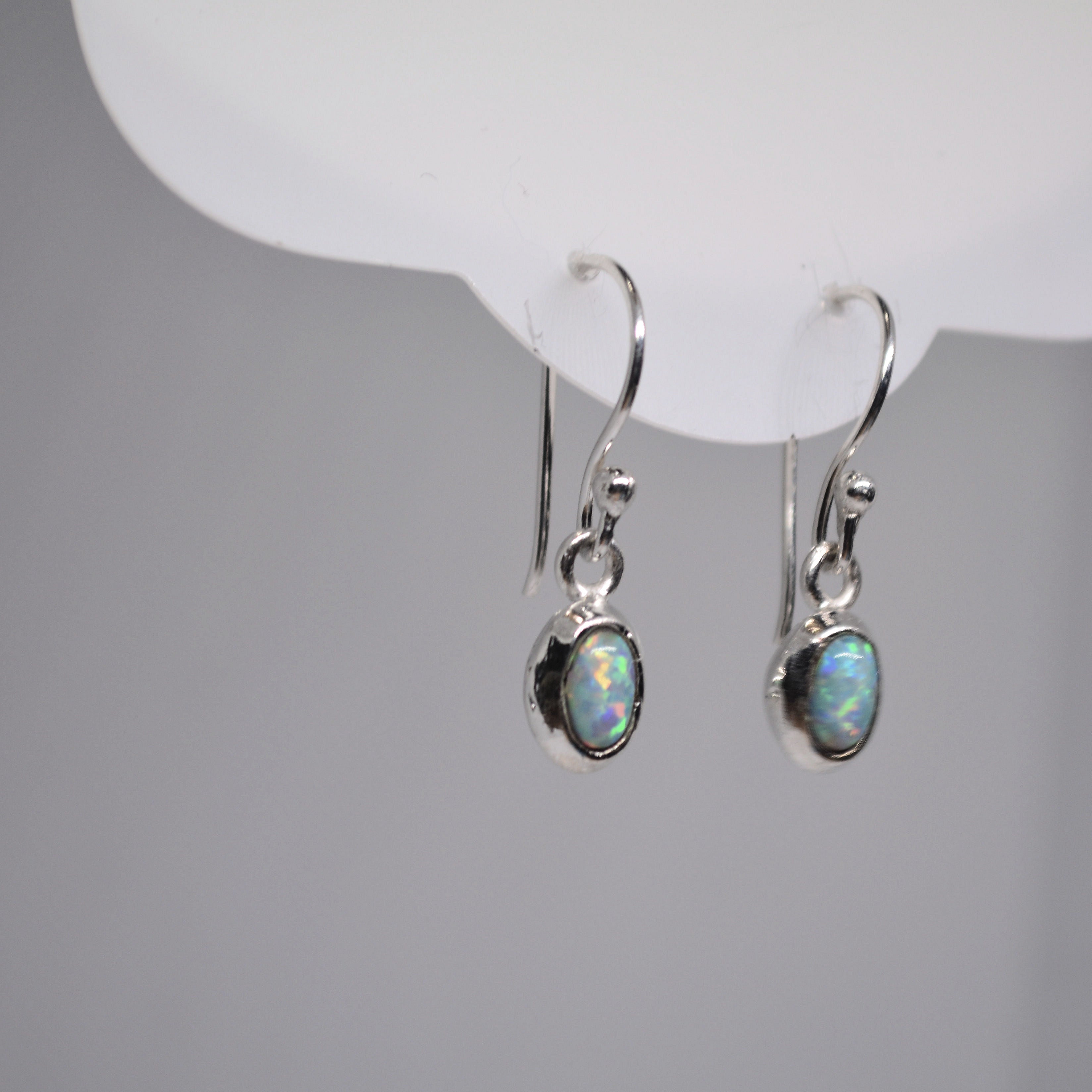 Just Neat Stuff White Opal Earrings — main product shot