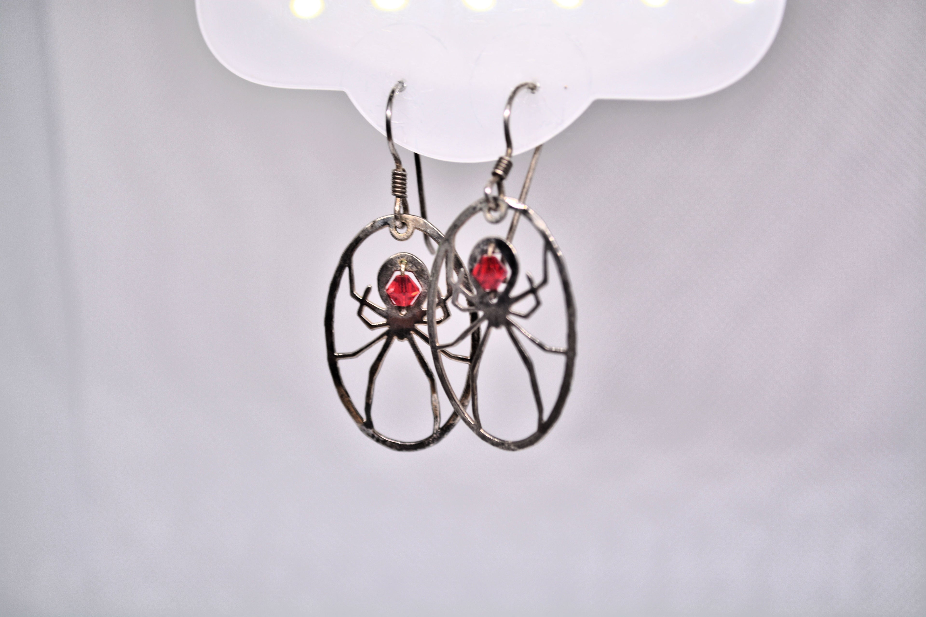 Just Neat Stuff Spider Earrings — detail close-up