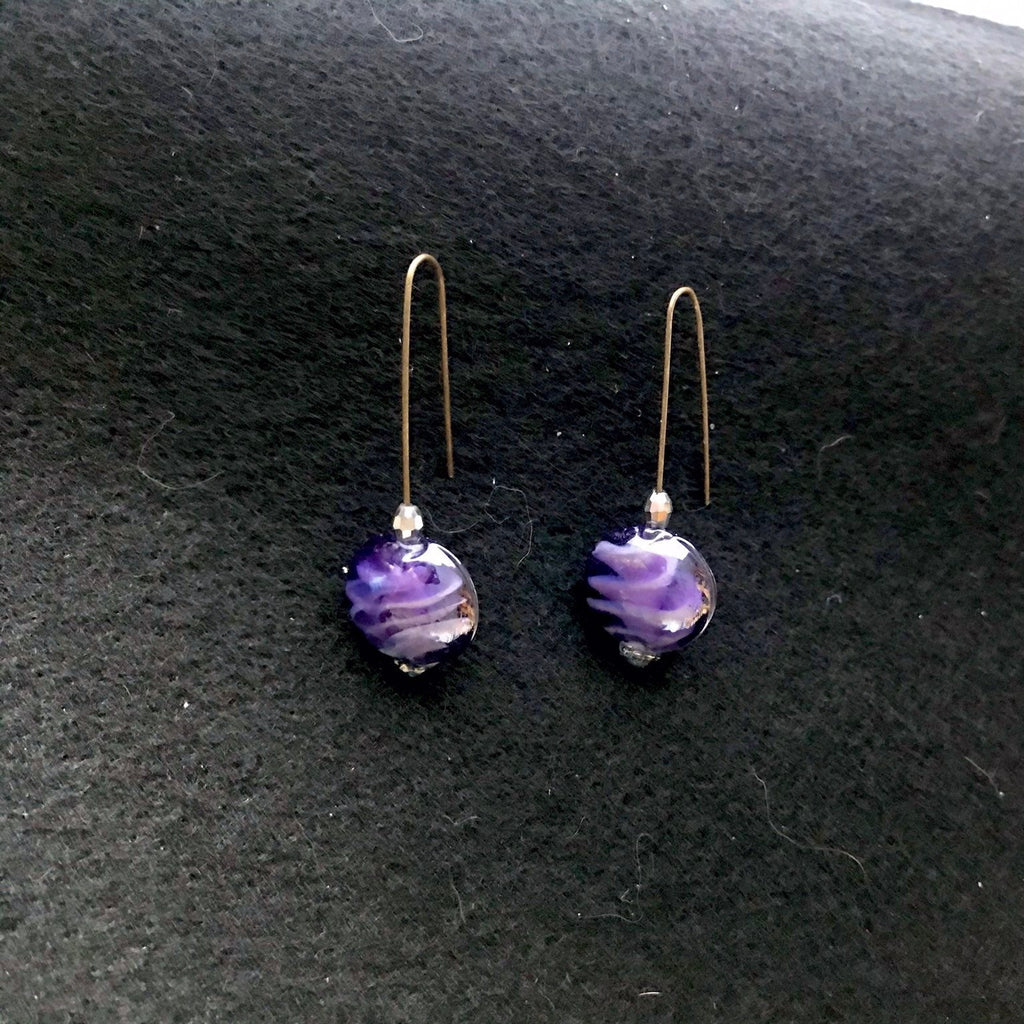 Just Neat Stuff Purple glass earrings — lifestyle context