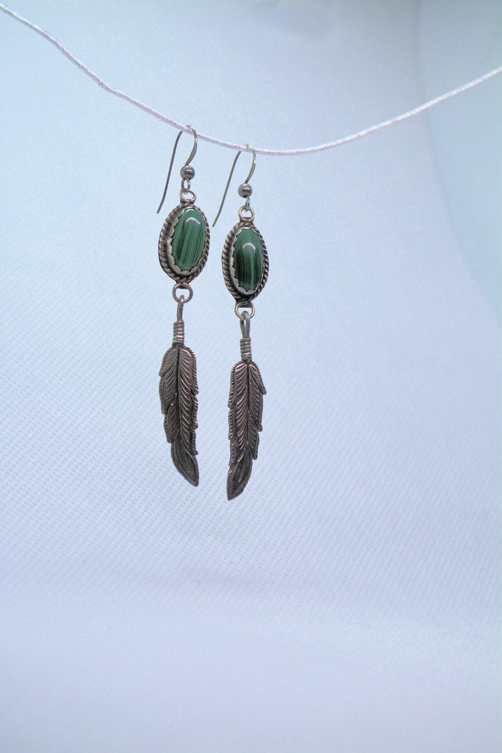 Just Neat Stuff Malachite Feather — lifestyle context