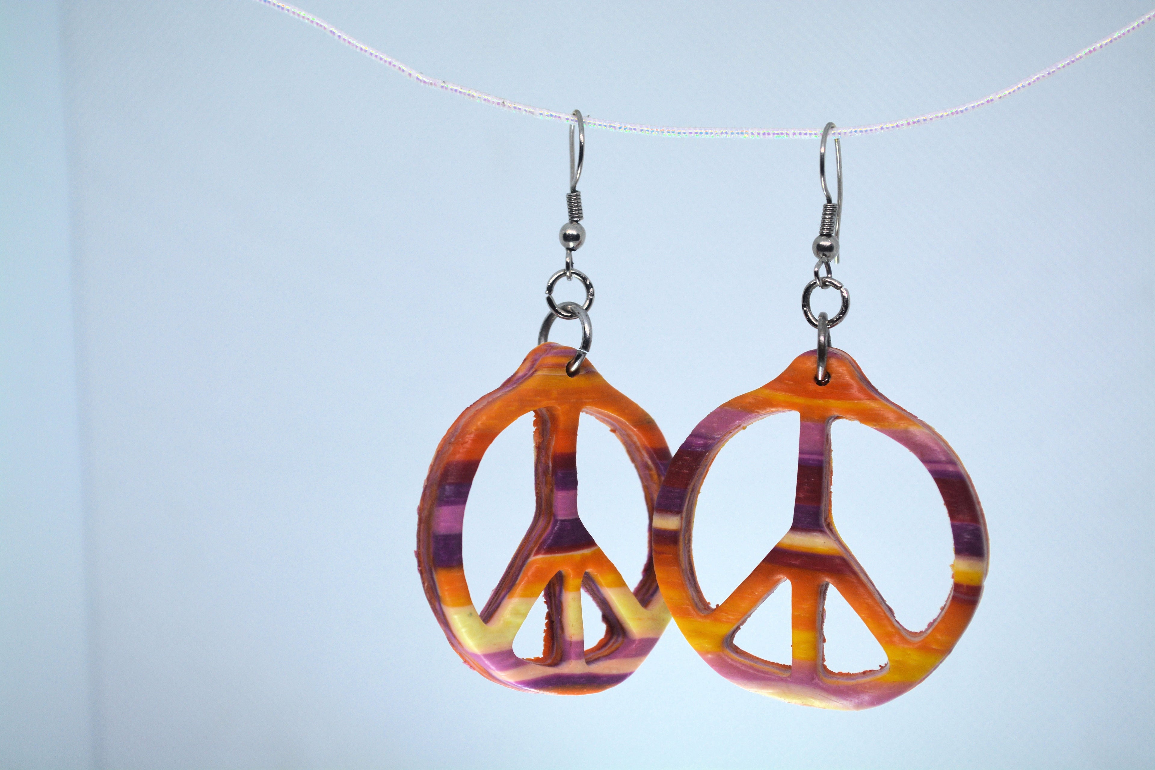 Just Neat Stuff Peace Earrings — detail close-up