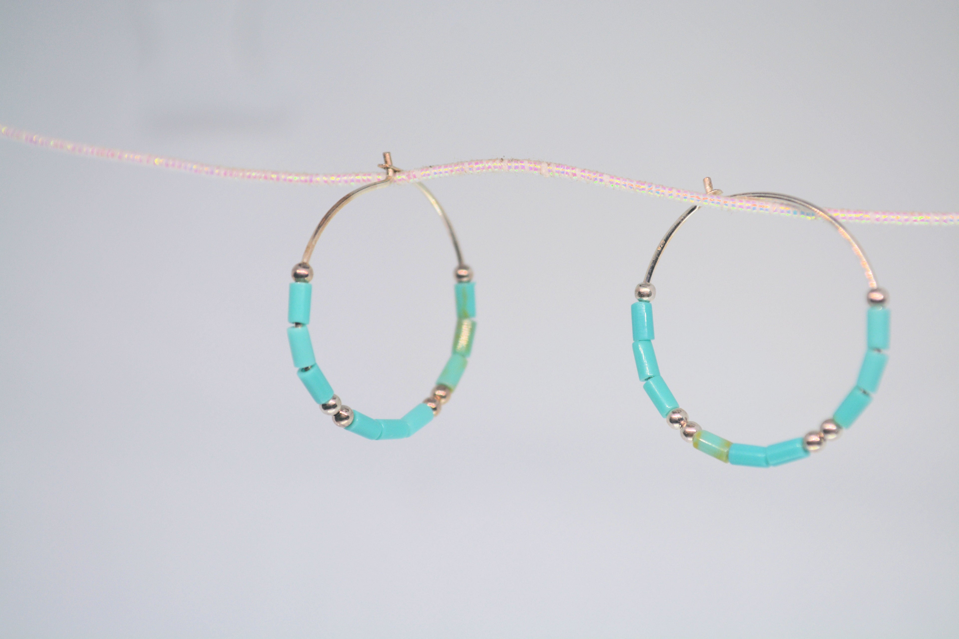 Just Neat Stuff Turquoise hoop earrings — in-use photo