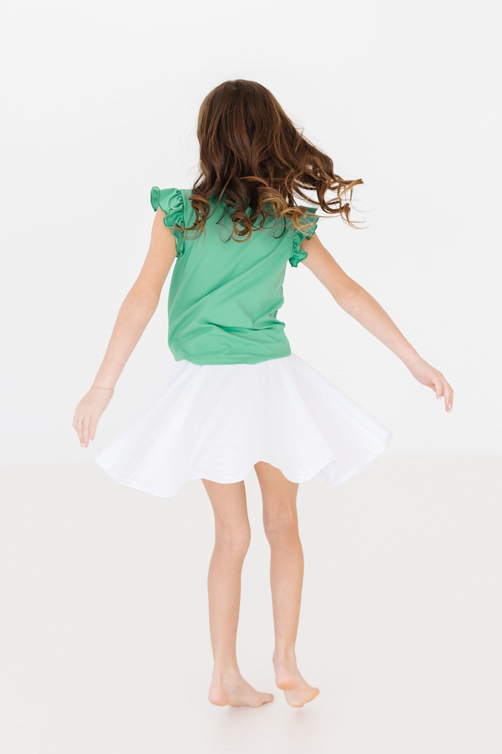 Mila & Rose ® Kelly Green S/S Ruffle Tee — lifestyle context