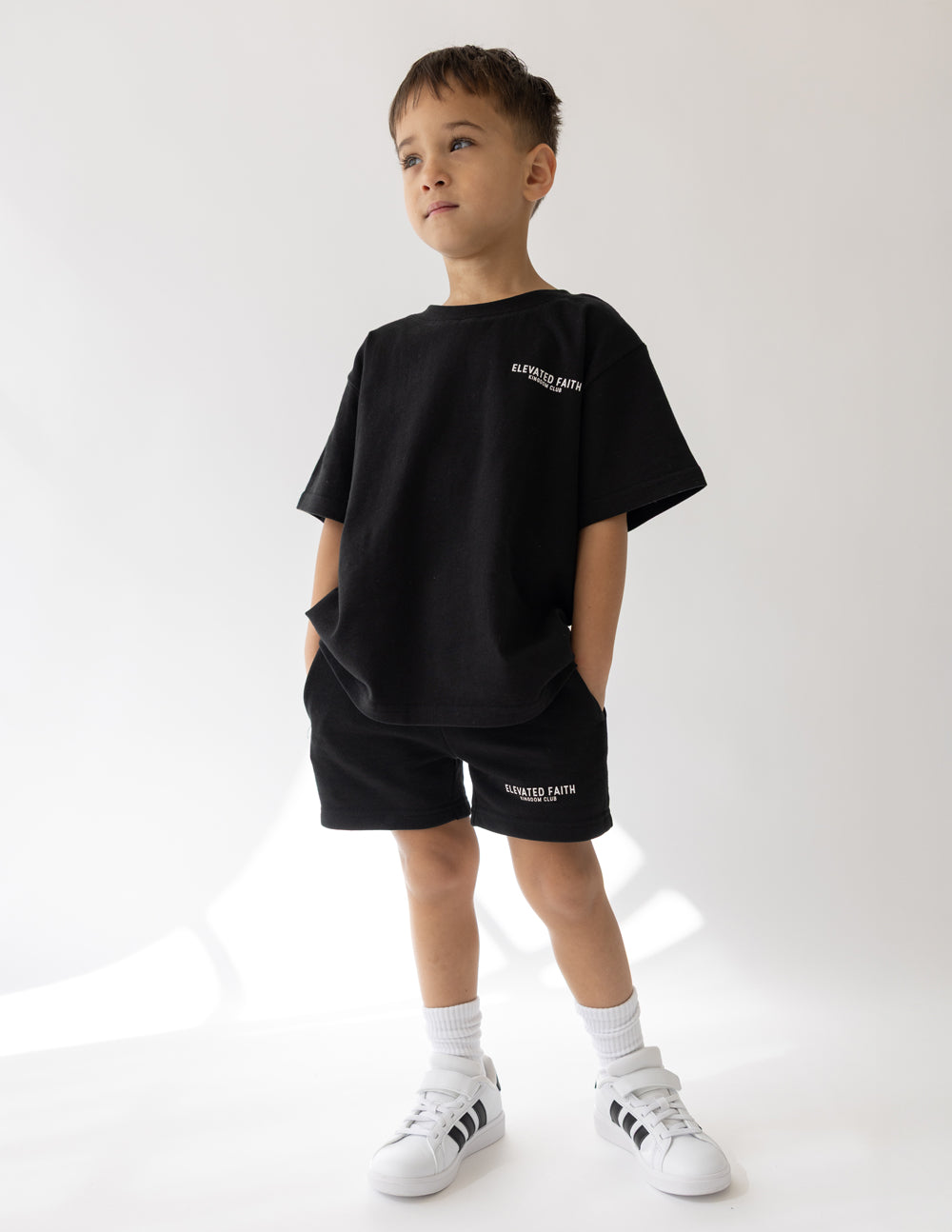 Elevated Faith Kingdom Club Black Kids Tee — side view