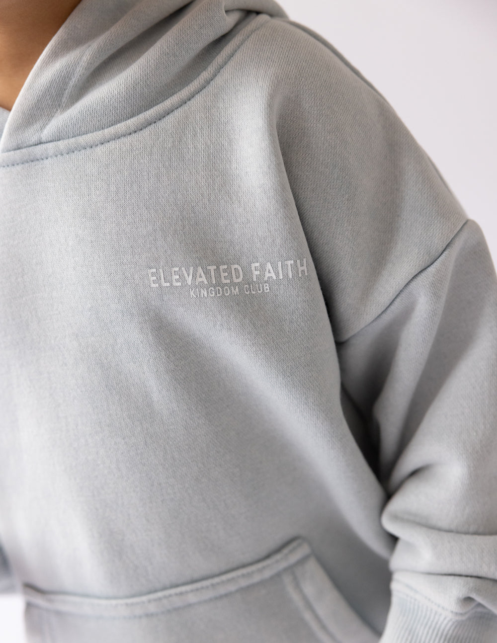 Elevated Faith Kingdom Club Blue Kids Hoodie — side view
