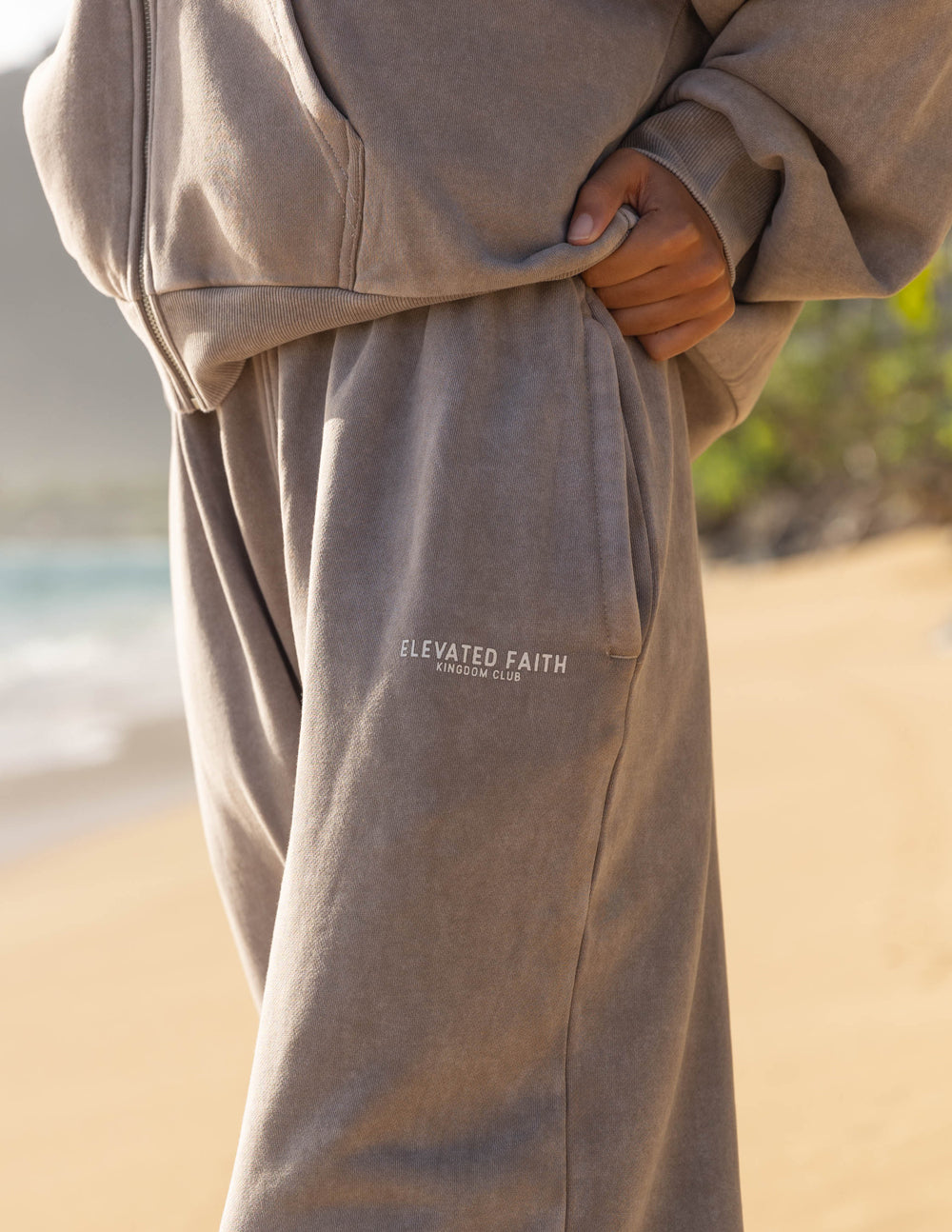 Elevated Faith Kingdom Club Brown Wide Leg Sweatpant — Elevated Faith branding close-up