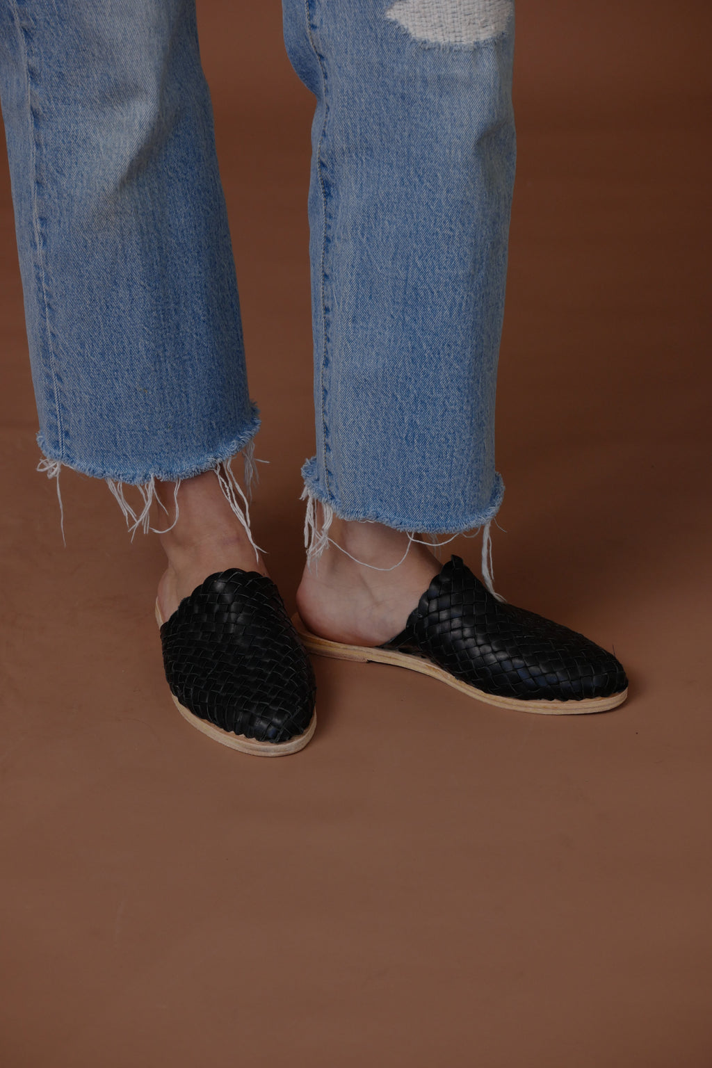 LOLA Y TULA Hand Woven Leather Slides Black — lifestyle context