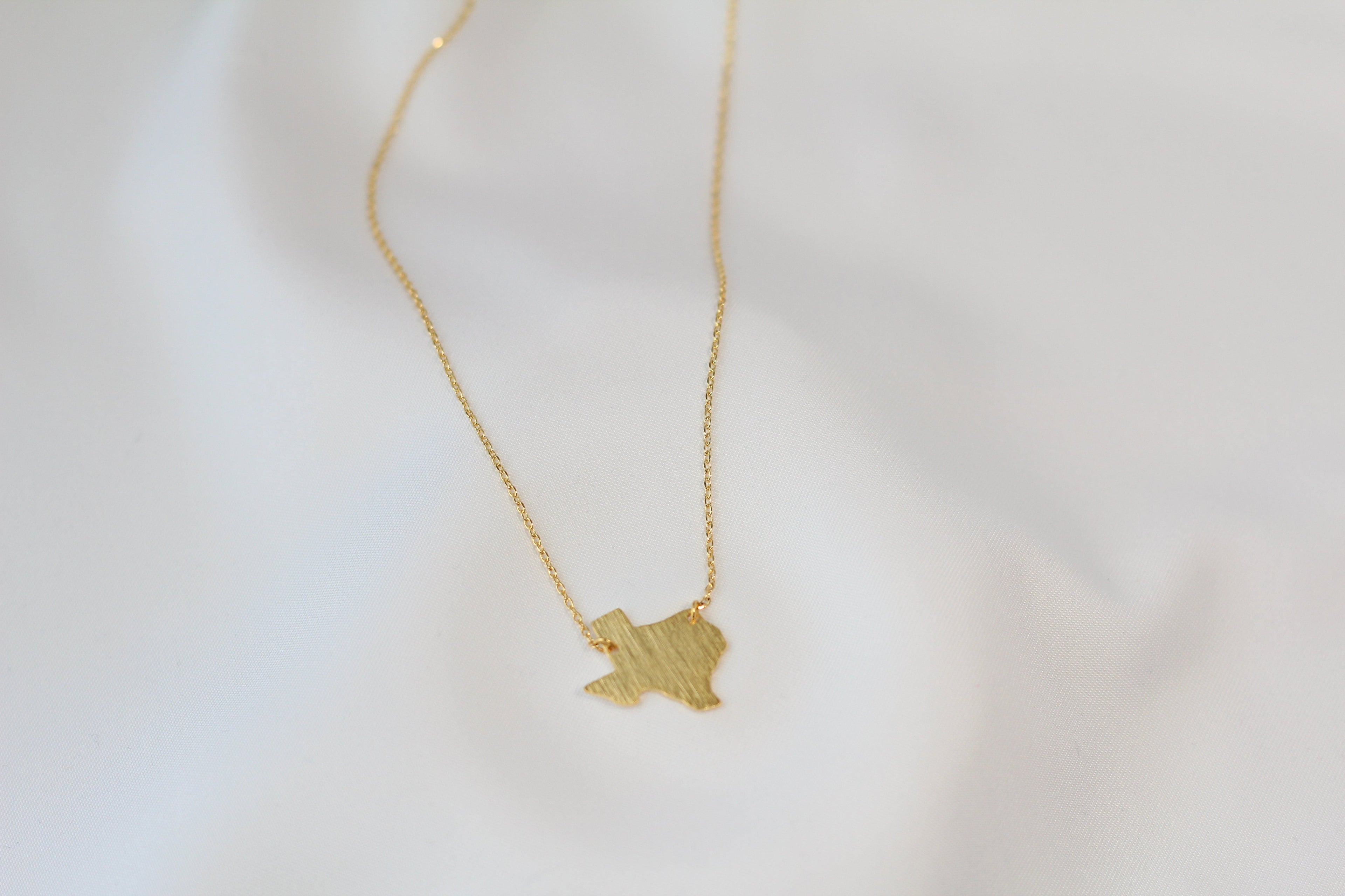 KADOU BOUTIQUE Texas State Map Necklace - Matte Polish — in-use photo