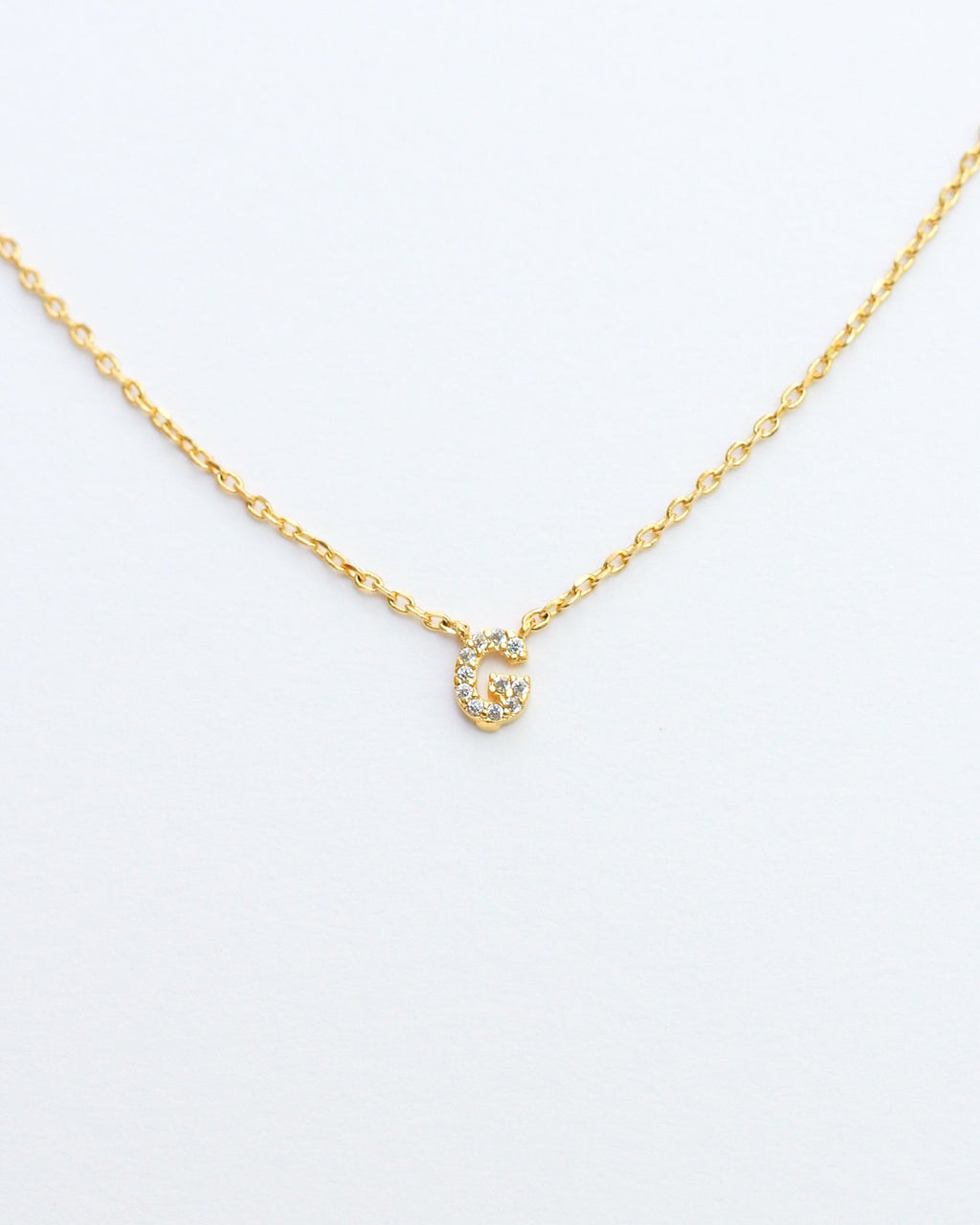 KADOU BOUTIQUE Mini Pave Initial Necklace — in-use photo