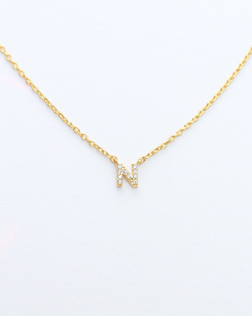 KADOU BOUTIQUE Mini Pave Initial Necklace — feature highlight