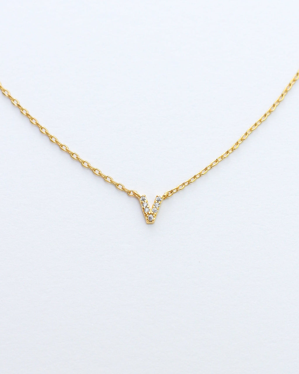 KADOU BOUTIQUE Mini Pave Initial Necklace — lifestyle context
