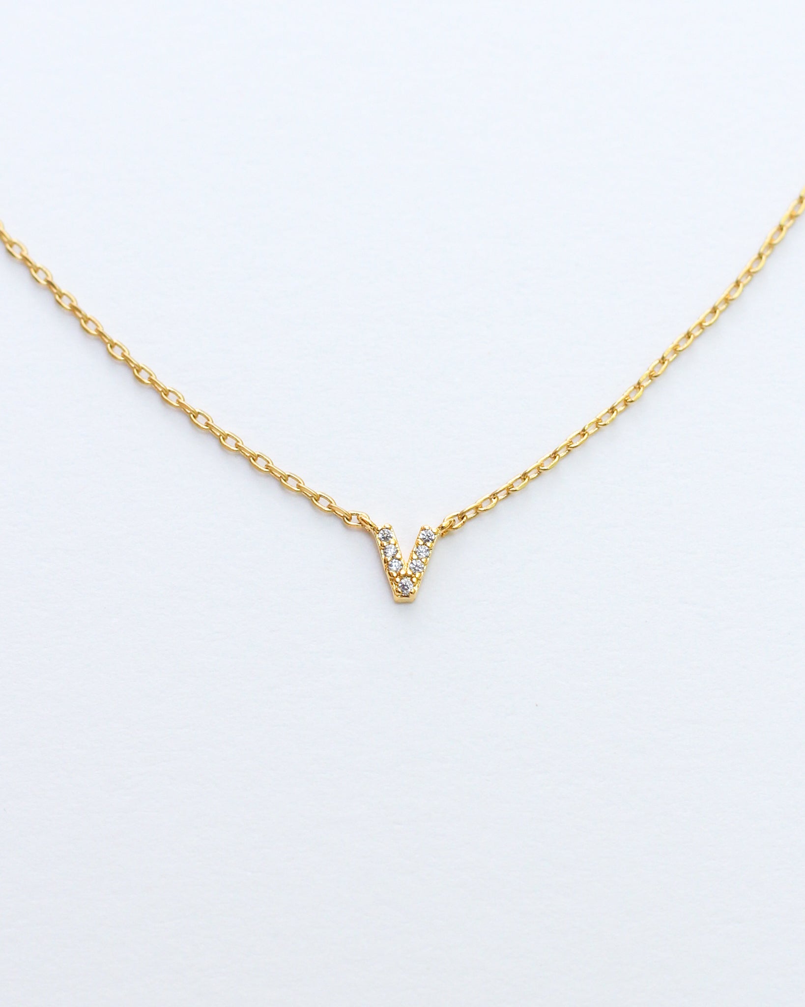 KADOU BOUTIQUE Mini Pave Initial Necklace — lifestyle context