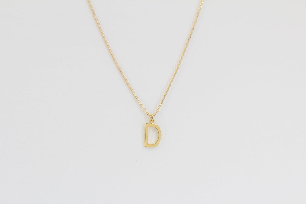 KADOU BOUTIQUE Letter Pendent Necklace — detail close-up