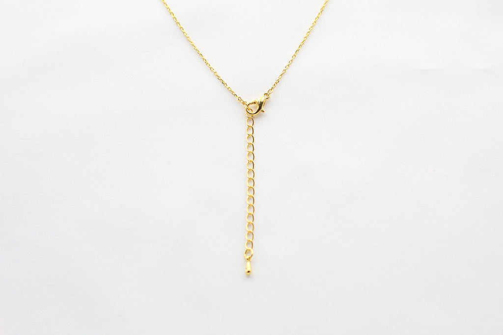 KADOU BOUTIQUE Shiny Lock and Key Ring Necklace — detail close-up