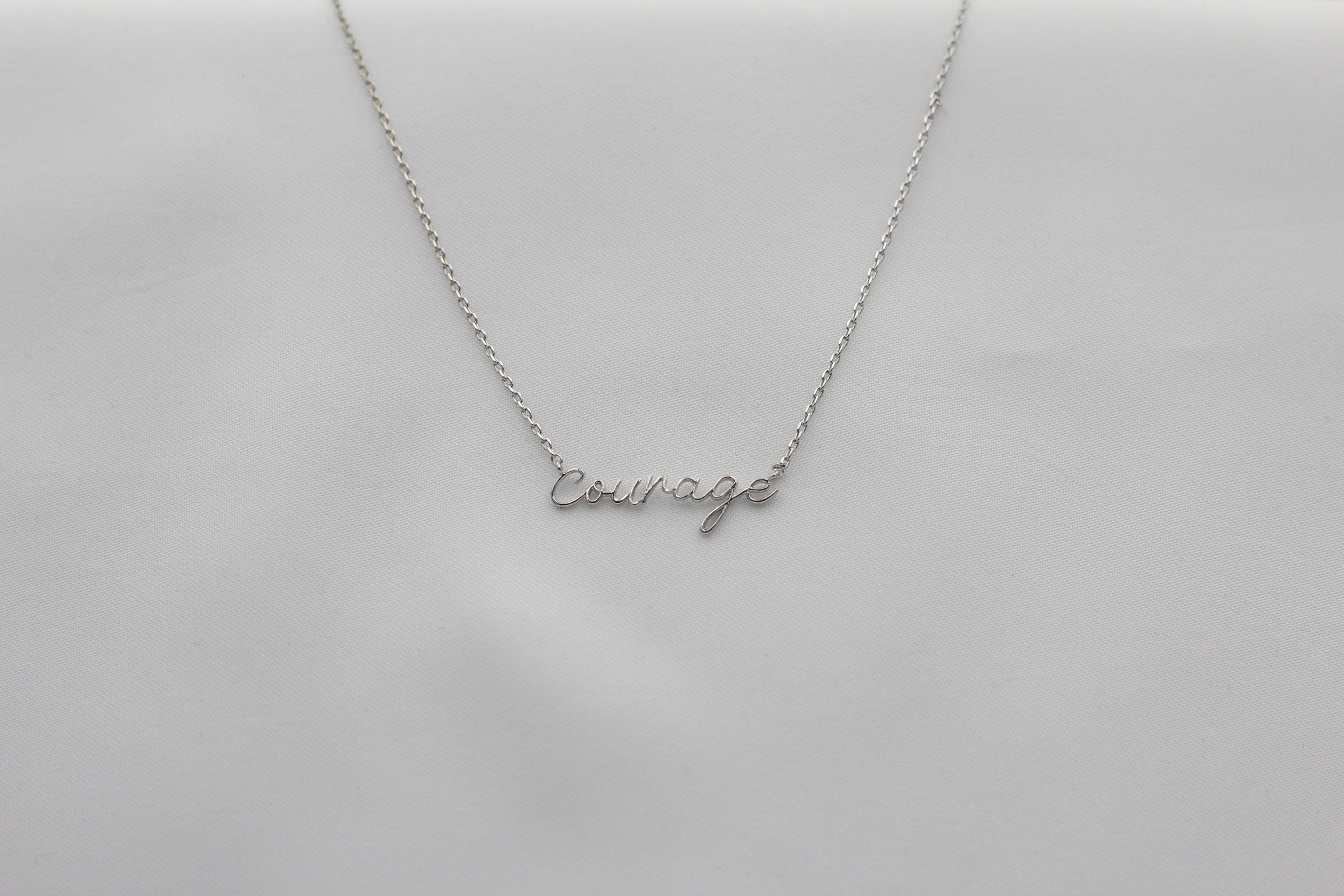 KADOU BOUTIQUE Courage Necklace - Dainty Script — lifestyle context