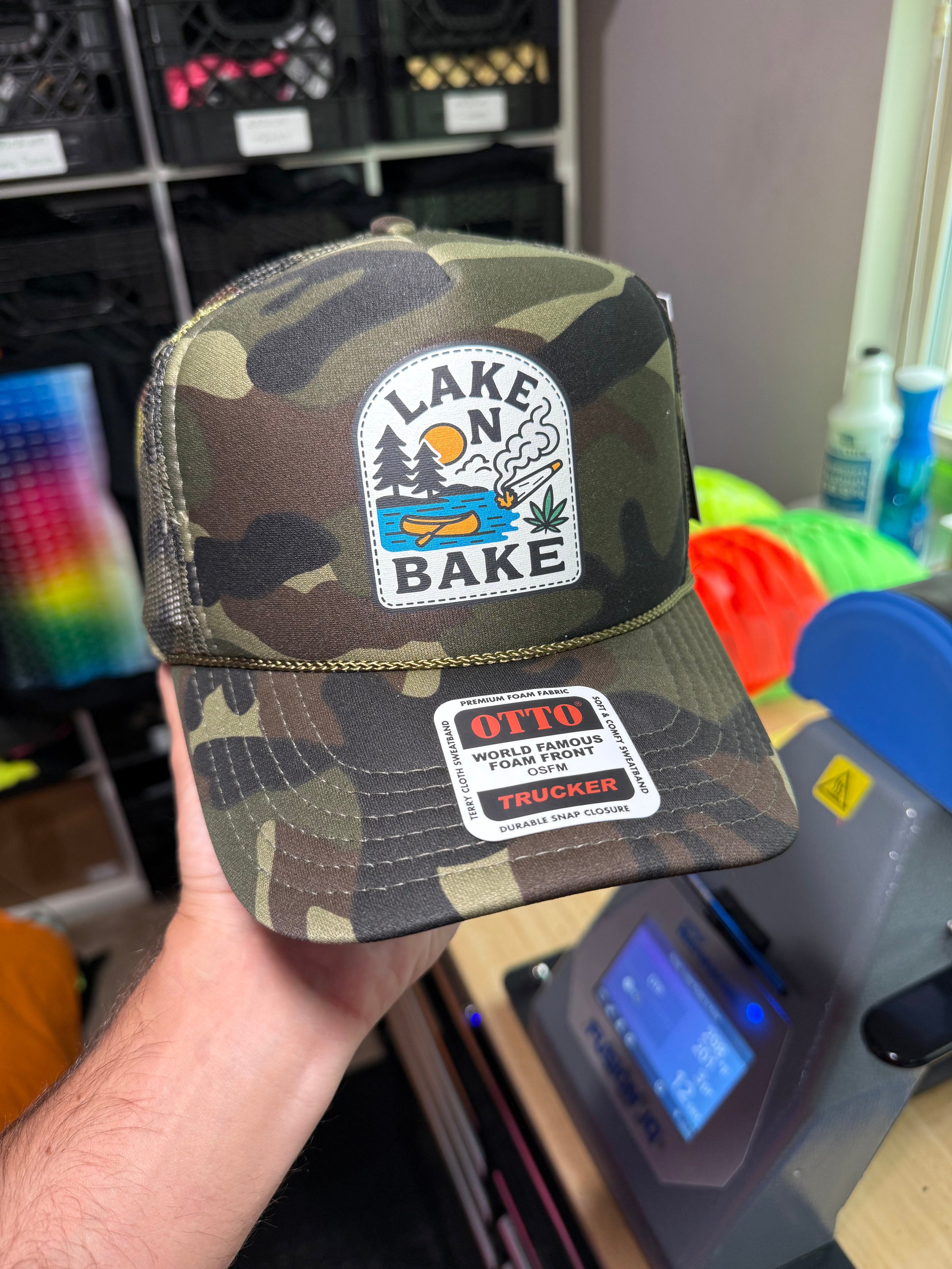 Luckless Outfitters Lake N Bake Trucker Hat — detail close-up