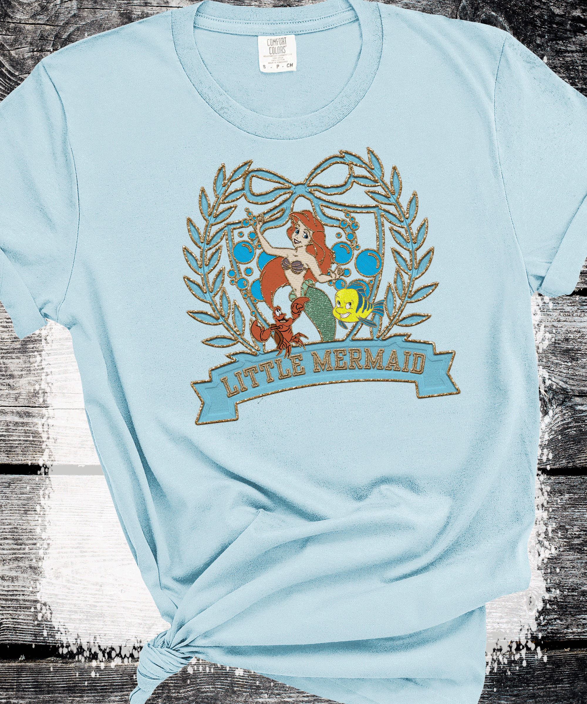 A Blessed Texas Mess Boutique Old School Vintage Little Mermaid, Retro 80s 90s Disney shirts, Flounder and… — A Blessed Texas Mess Boutique branding close-up