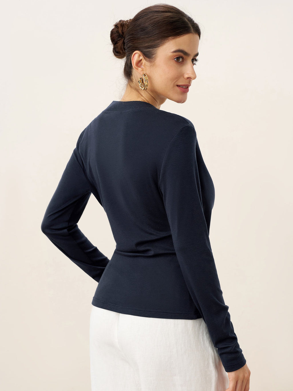 LINTICO Wool Lyocell Asymmetric Ruched Overlap V-Neck Top TILLY — LINTICO branding close-up