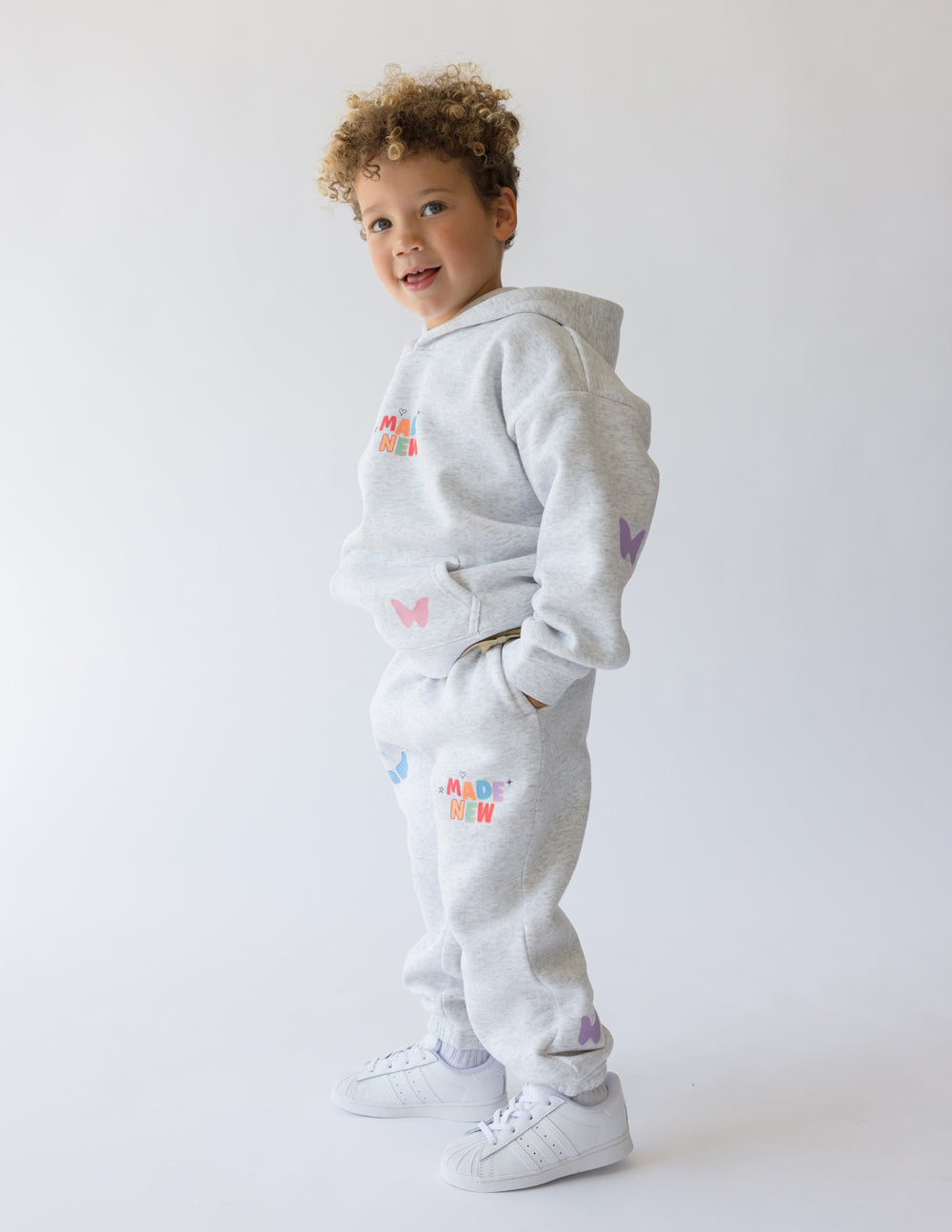 Elevated Faith Made New Kids Hoodie — lifestyle context