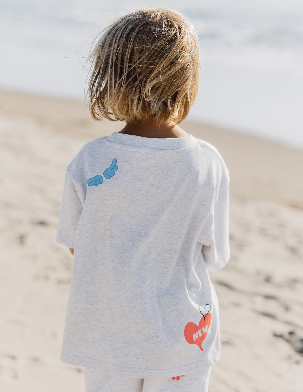 Elevated Faith Made New Kids Tee — side view