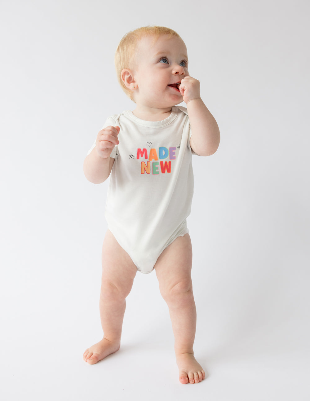 Elevated Faith Made New Onesie — side view