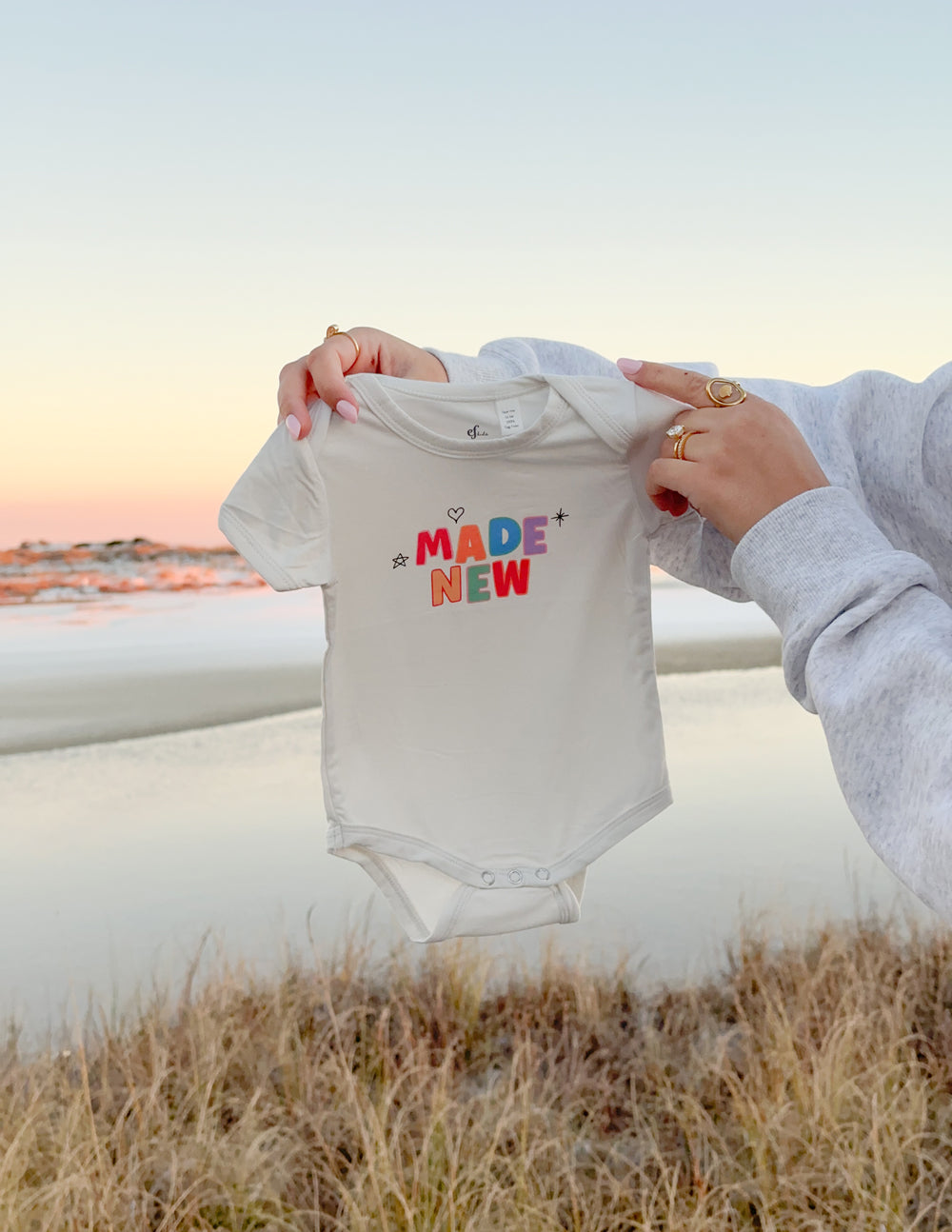 Elevated Faith Made New Onesie — back view