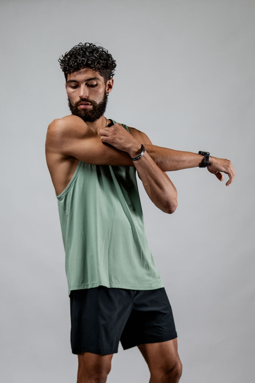 Varlo Men's Terra Recovery Tank (Low Light Olive) — Varlo branding close-up