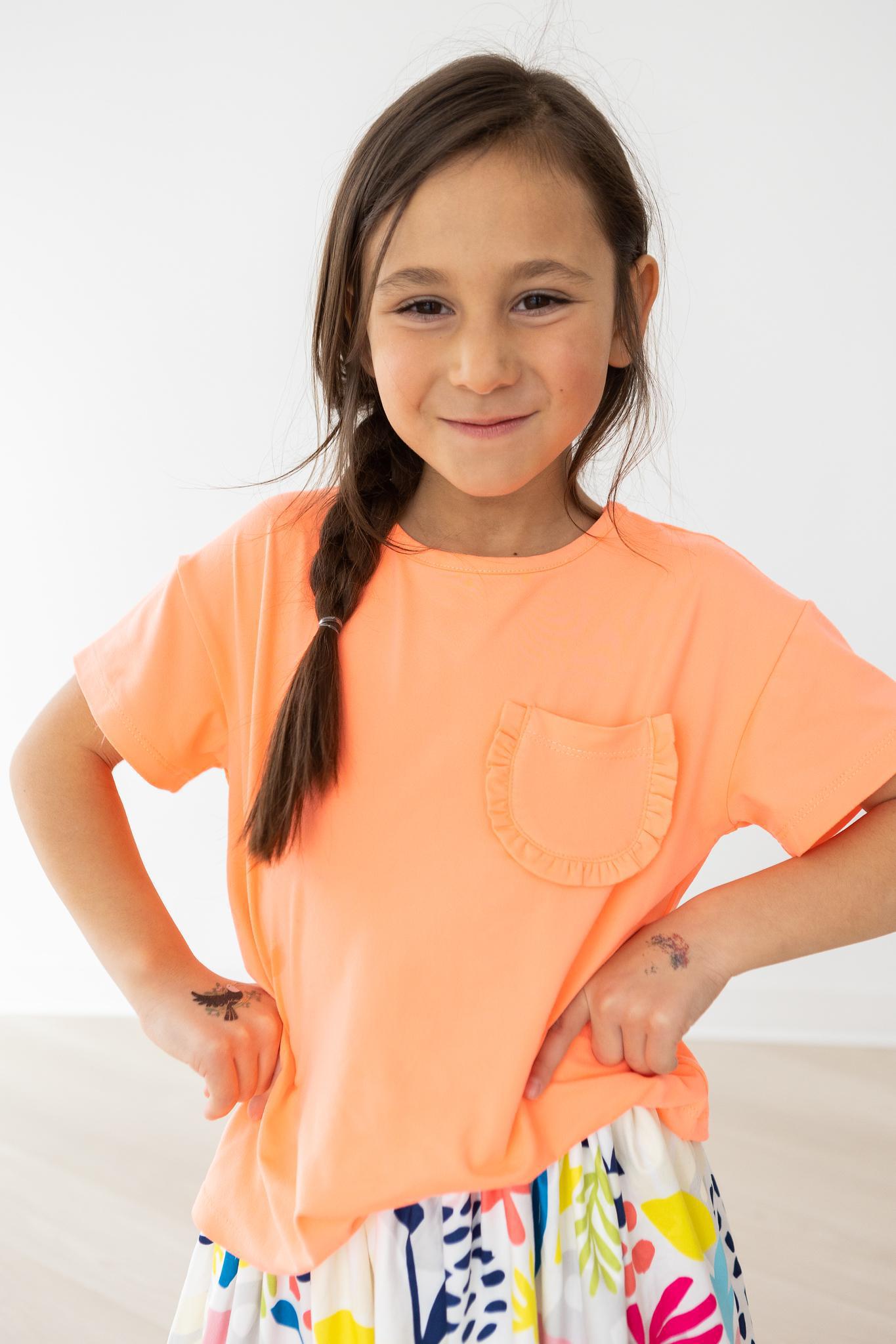 Mila & Rose ® Neon Coral Ruffle Pocket Tee — lifestyle context