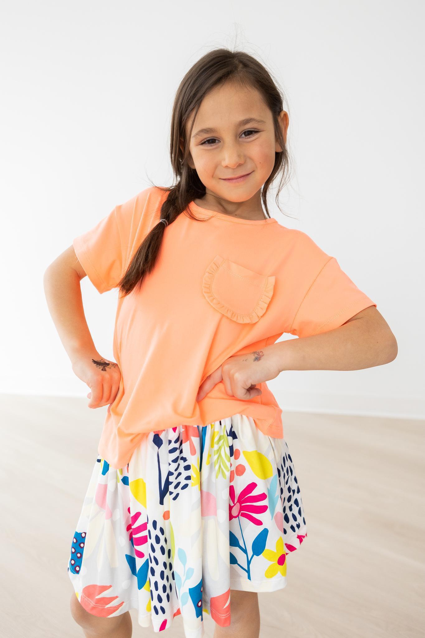 Mila & Rose ® Neon Coral Ruffle Pocket Tee — side view