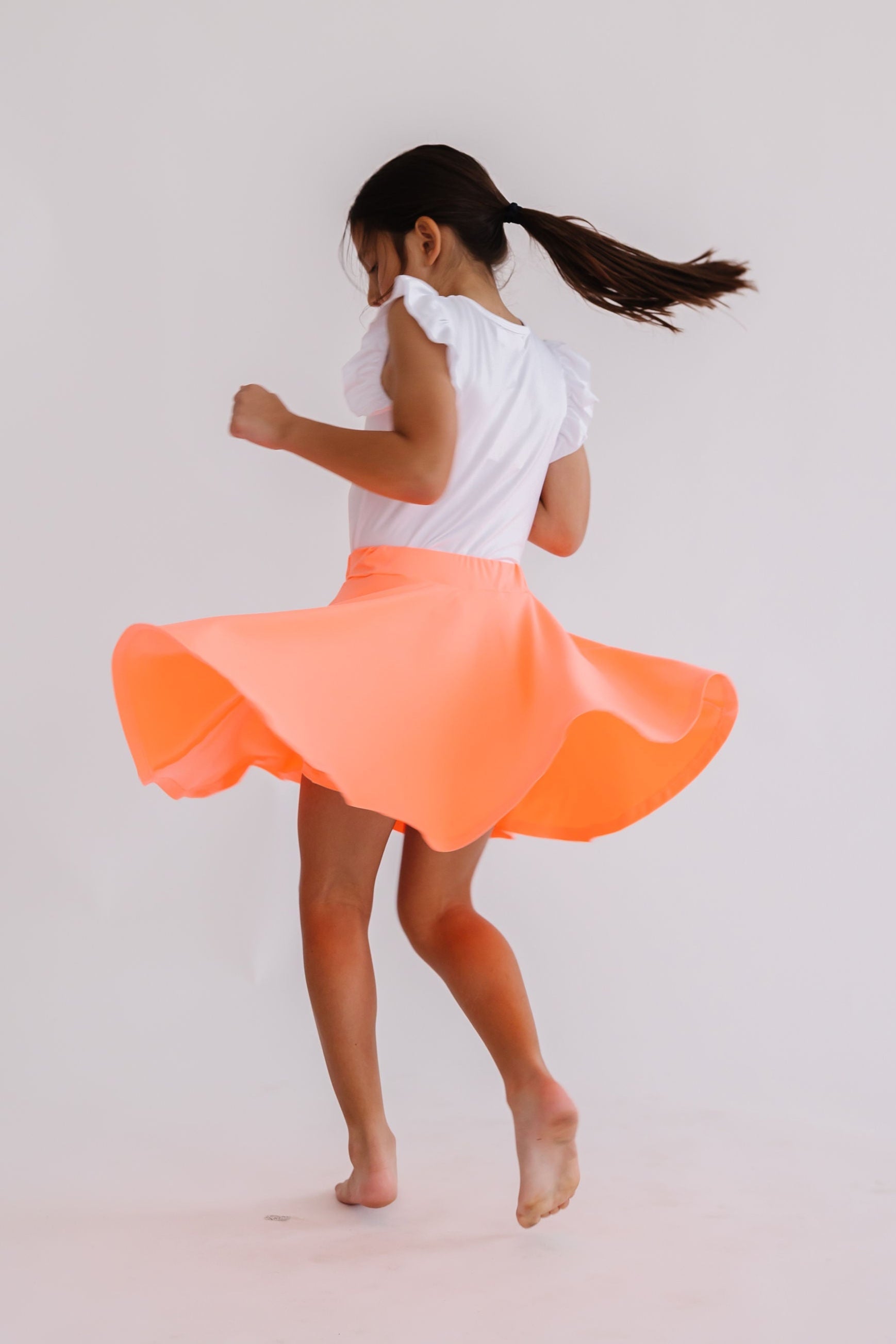 Mila & Rose ® Neon Coral Twirl Skort — detail close-up