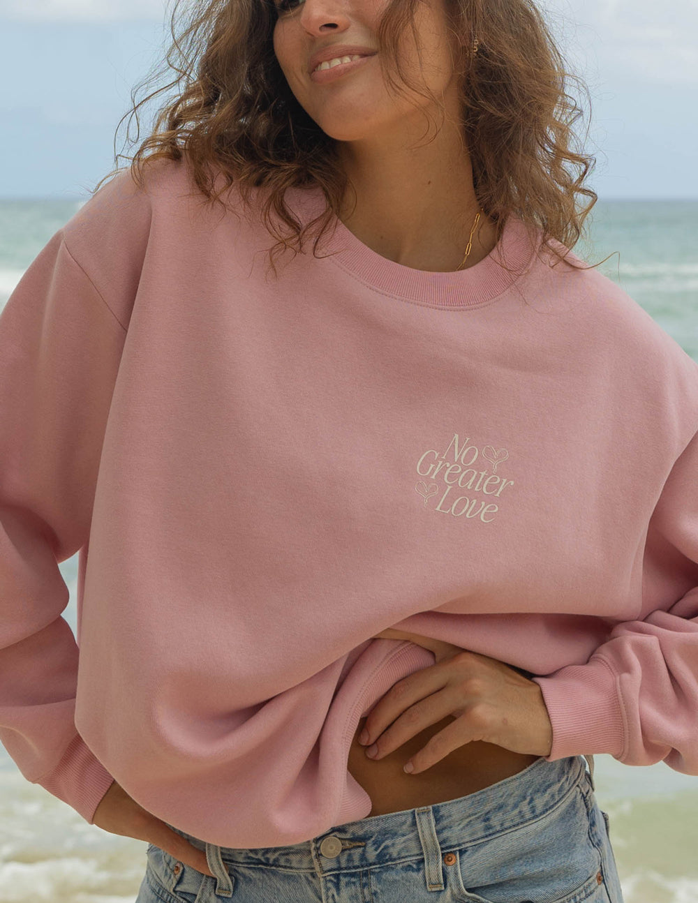 Elevated Faith No Greater Love Unisex Crewneck — Elevated Faith branding close-up