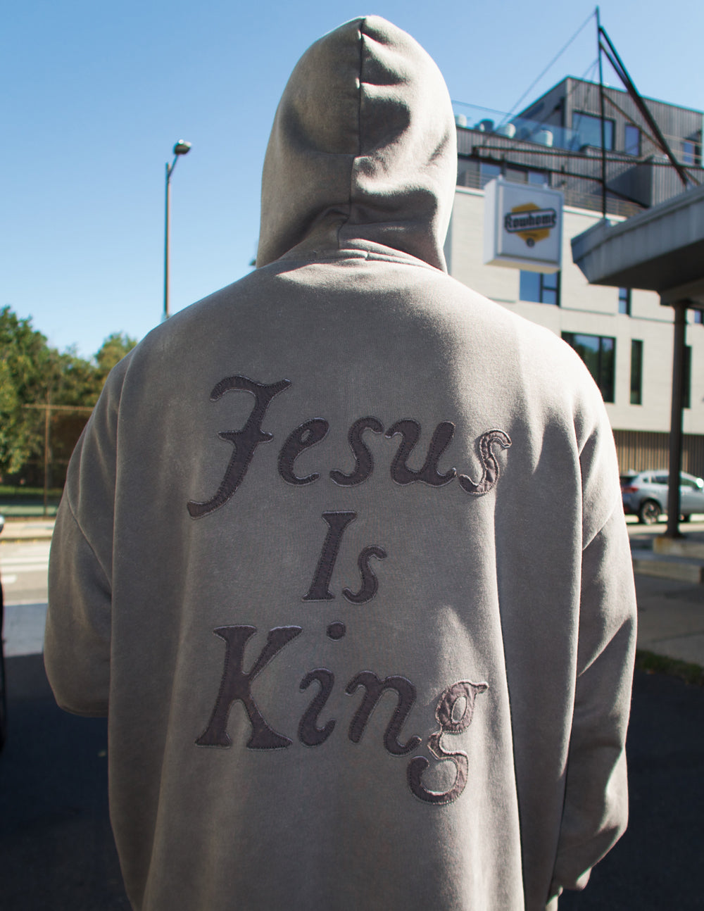 Elevated Faith Not Sorry Jesus Is King Unisex Hoodie — Elevated Faith branding close-up