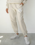 Elevated Faith Our World Needs Jesus Beige Unisex Sweatpant — main product shot