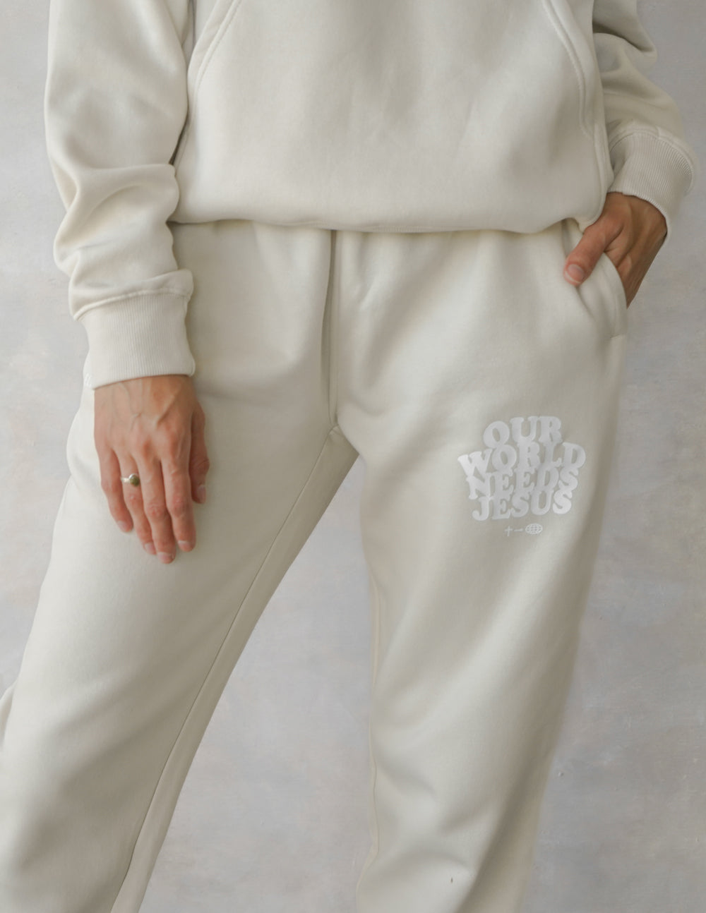 Elevated Faith Our World Needs Jesus Beige Unisex Sweatpant — lifestyle context